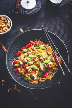 Stir fry noodles with chicken, vegetables and roasted cashew nuts
