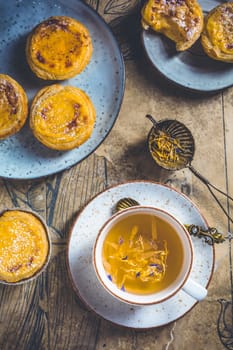 Pastel de nata with cup of herbal tea, Portugal sweet egg and pudding pastry
