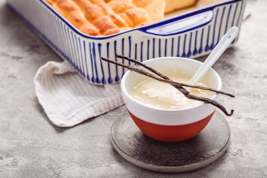 Buchteln, sweet rolls made of yeast dough with milk and butter, served with vanilla sauce. Traditional meatless dish in Europe