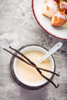 Buchteln, sweet rolls made of yeast dough with milk and butter, served with vanilla sauce. Traditional meatless dish in Europe