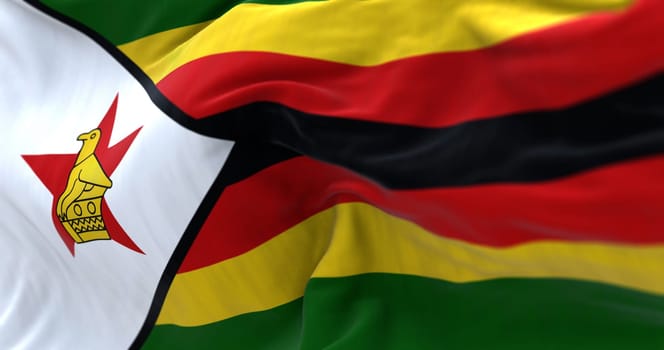 Zimbabwe national flag waving. Horizontal stripes of green, yellow, red and black. White triangle with a red star and yellow bird. 3D illustration render. Selective focus. Rippled textile background