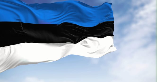 The national flag of Estonia waving in the wind on a clear day. Three equal horizontal stripes of blue, black and white. 3D illustration render. Rippled textile.
