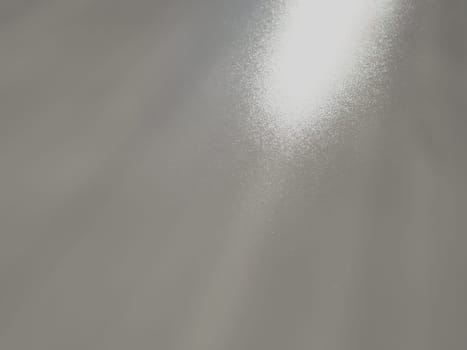 Diagonal rays of light on a gray background. Blurred abstract background light effect, light leaks. Side surface illumination. Small sparks and glow. Shine, glint or glare. Right top left down.