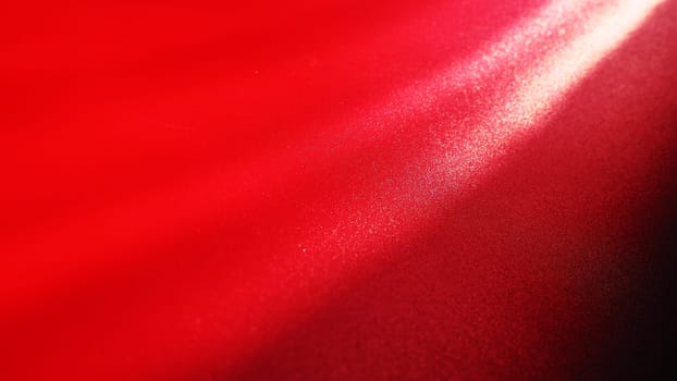 Diagonal rays of light on a red or scarlet background. Blurred abstract background light effect, light leaks. Side surface illumination. Parallel and asymmetric lines or stripes of light at an angle