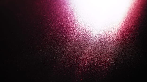 Diagonal rays of light on a red, burgundy and black background. Blurred abstract background light effect and leaks. Side surface illumination. Parallel and asymmetric lines, stripes of light at angle