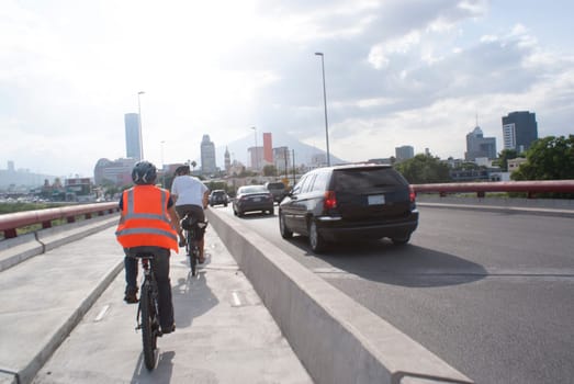 Photograph of a pair of urban cyclists on a cycling track