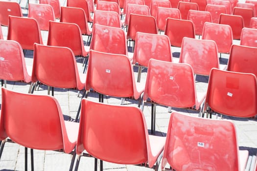 red chair lined. Image of a tens of red chairs lined