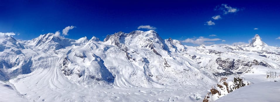 Panorama of Matterhorn snow mountains on a clear sunny day, Zermatt, Switzerland