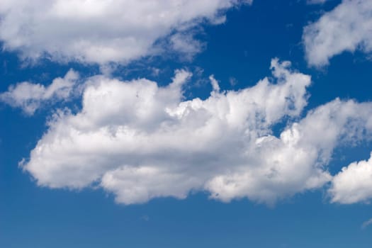 White clouds against a blue sky.