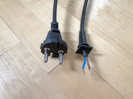 black electrical wire with electric plug