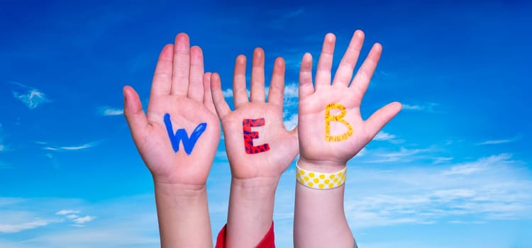 Children Hands Building Colorful English Word Web. Blue Sky As Background