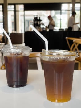 Iced americano with orange and iced americano in coffee shop, stock photo
