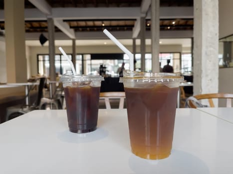 Iced americano with orange and iced americano in coffee shop, stock photo