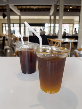 Iced americano with orange and iced americano in coffee shop, stock photo