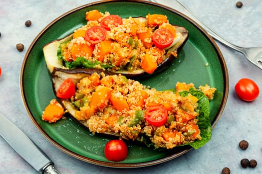 Baked eggplant stuffed with pumpkin and quinoa. Vegetarian food recipe
