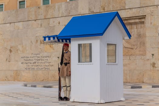 ATHENS, GREECE - MAY 06 2022: Presidential ceremonial guards - Evzones at the Tomb of the Unknown Soldier in front of the Greek Parliament, Athens, Greece