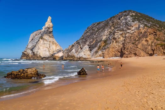 Sintra, Portugal: 22 October 2022 - Praia da Ursa (Ursa Beach) with people, in Sintra near Lisbon in Portugal.