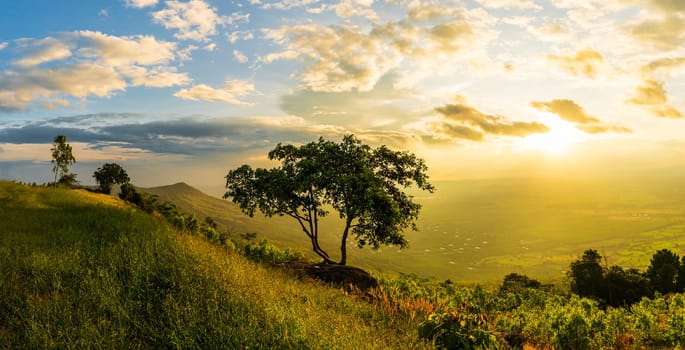 Mountain landscape with colorful vivid sunset on the cloudy sky,Sunset in nature with lighted clouds