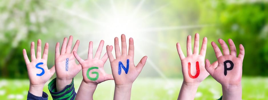 Children Hands Building Colorful English Word Sign Up. Summer, Sunny Green Grass Meadow As Background