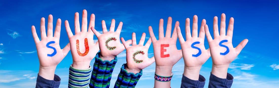 Children Hands Building Colorful English Word Success. Blue Sky As Background