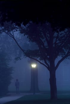 Student walks to class at Dartmouth College at dusk. New Hampshire