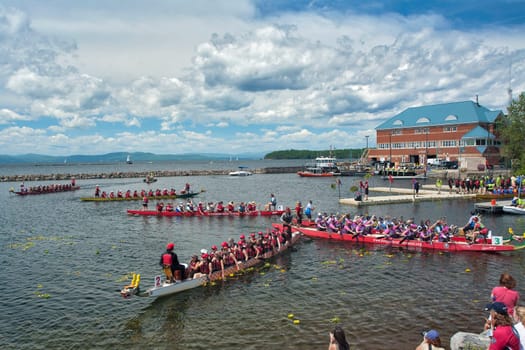 Dragon boat races on Lake Champlain in Burlington, Vermont, USA.  The races are held to raise money for breast cancer survivors.