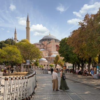 Istanbul, Turkey - August 30 2022: Tourists and locals near to Hagia Sophia Mosque, or Ayasofya Camii, formerly a Greek Orthodox church, during Victory Day holiday