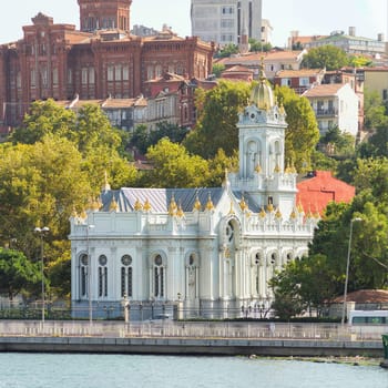 View from Golden Horn of Neo Byzantine architecture style Bulgarian St. Stephen Church, a Bulgarian Orthodox church, with Phanar Greek Orthodox College in the far end, Balat district, Istanbul, Turkey