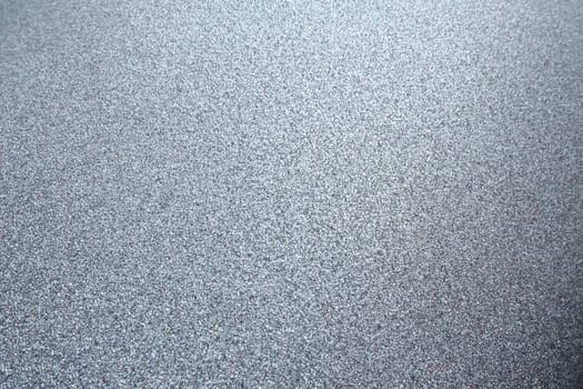 silver gray glitter texture christmas background. Bent shiny velvet paper.
