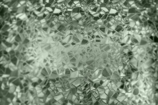 Corrugated glass green background. Abstract pattern on the surface of a window. Protective opaque film