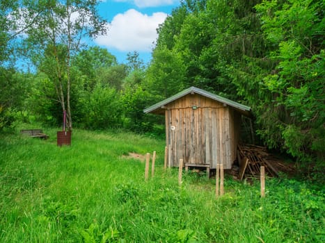 Small forest worker's hut on the edge of a green forest near the town of Nesselwang in Bavaria.