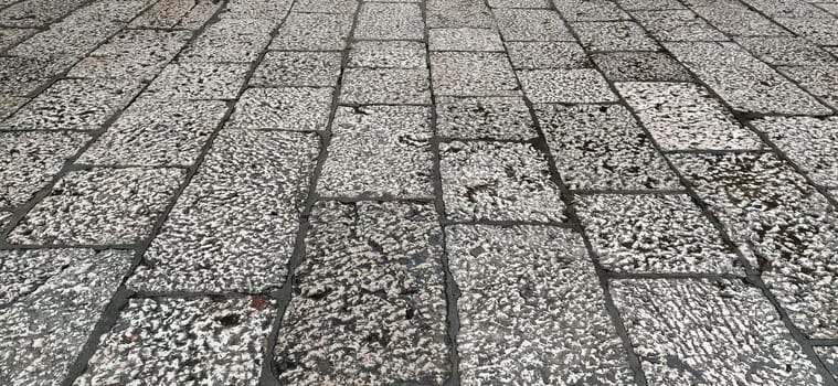 White marble natural pattern for background. marble surface. Sarajevo, Bosnia and Herzegovina, historic center. Close-up of the pavement near the mosque. Light marble or stone