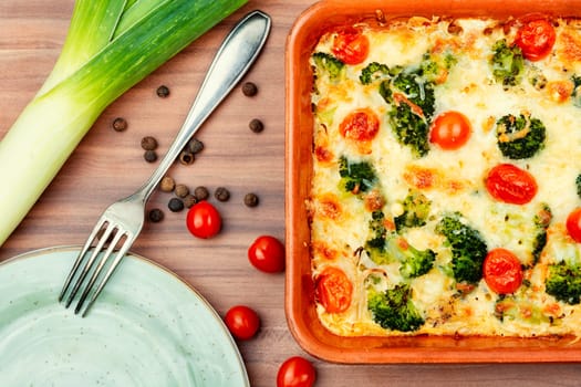 Baked potato graten with broccoli. Tasty broccoli casserole in baking dish