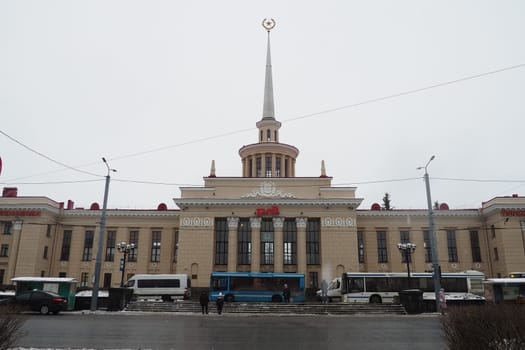 Petrozavodsk, Republic of Karelia, Russia, January 16, 2023. Gagarin Square, Lenin Avenue. The daily life of Russians. Public transport and cars are driving. Train Station. Snow, snowdrifts and slush
