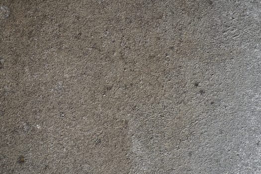 Plastered wall texture. Whitewash surface. Abstract background. Retro wall built structure texture. Cracks and bumps on the concrete wall. Uneven coloring with water-based paint. Old tattered plaster.