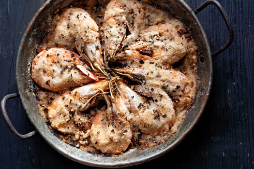 close up of pan of salt baked prawns shrimps