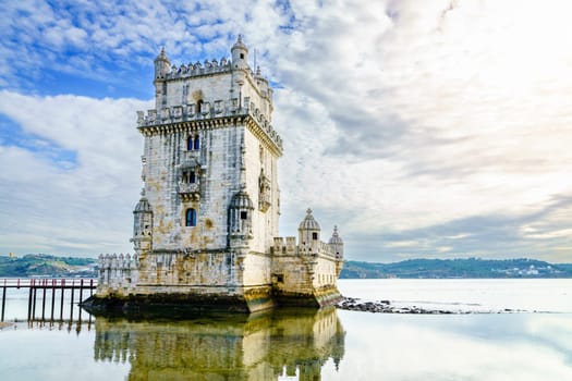View of Torre de Belem or Bethlehem Tower against the Tagus River in Lisbon, Portugal