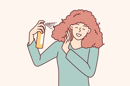 Woman uses spray to create cool hairstyle before going to party or gala dinner. Girl is engaged in independent hair care, wanting to have beautiful hairstyle thanks to cosmetic products