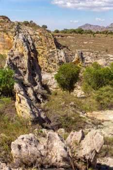 Isalo National Park in Ihorombe Region. Wilderness landscape with water erosion into rocky outcrops, plateaus, extensive plains and deep canyons. Beautiful Madagascar panorama landscape.
