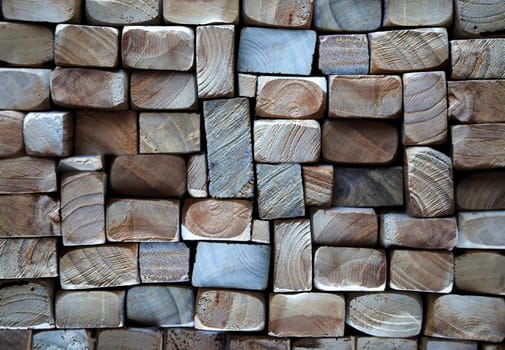 A texture of wood. Many stacked wooden slats from the front side.