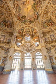 Italy, Stupinigi - January 2023: luxury interior of Royal Palace with baroque marbles and windows