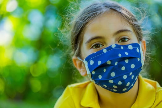 Little girl with mask against corona virus covid outdoor