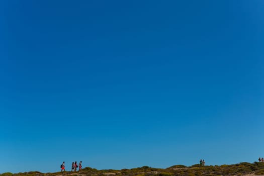 Sagres, Portugal - August 25, 2022: People at the cliff in Sagres village in Algarve, Portugal
