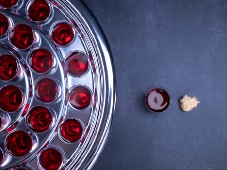 Taking communion concept - the wine and the bread symbols of Jesus Christ blood and body with Holy Bible. Easter Passover and Lord Supper concept.