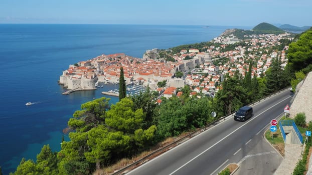 Dubrovnik, Croatia 08.14.2022 Road traffic near Dubrovnik old town in Croatia. Dubrovnik Ragusa administrative center of the Dubrovnik-Neretva County. Top view from the observation deck on the rock
