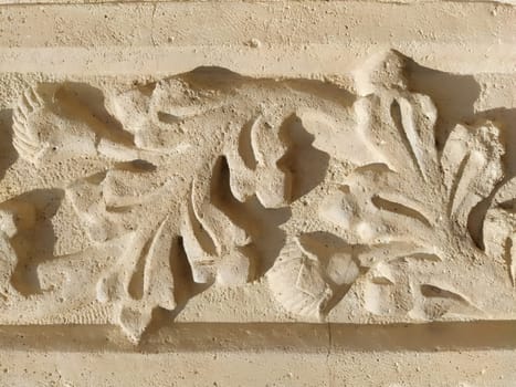 Ornament, sculptural drawing of structured plant elements. Decorating the wall with stucco in Dubrovnik, Croatia. A strip of shamrocks. Acanthus is a herbal vegetation, leaves are stucco elements