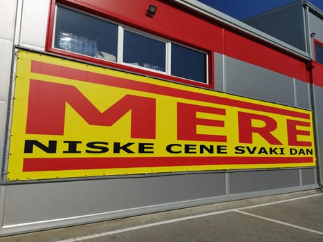 MERE discounter chain stores, Ruma, Serbia, April 15, 2022. Inscription - Low prices every day. Facade of the supermarket with logo and brand MERE. Food and household goods at cheap prices.