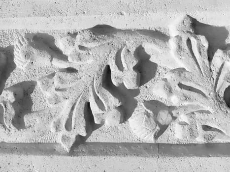 Ornament, sculptural drawing of structured plant elements. Decorating the wall with stucco in Dubrovnik, Croatia. A strip of shamrocks. Acanthus is a herbal vegetation, leaves are stucco elements