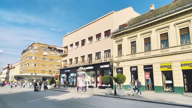 Novi Sad, Serbia 30 April 2022 Hotel Vojvodina is the oldest hotel in the center of the city. European tourism facility. Street with passers-by. Freedom Square. Hotel with rooms provision of services.