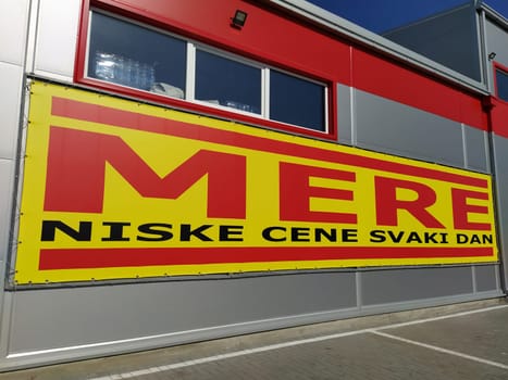 MERE discounter chain stores, Ruma, Serbia, April 15, 2022. Inscription - Low prices every day. Facade of the supermarket with logo and brand MERE. Food and household goods at cheap prices.